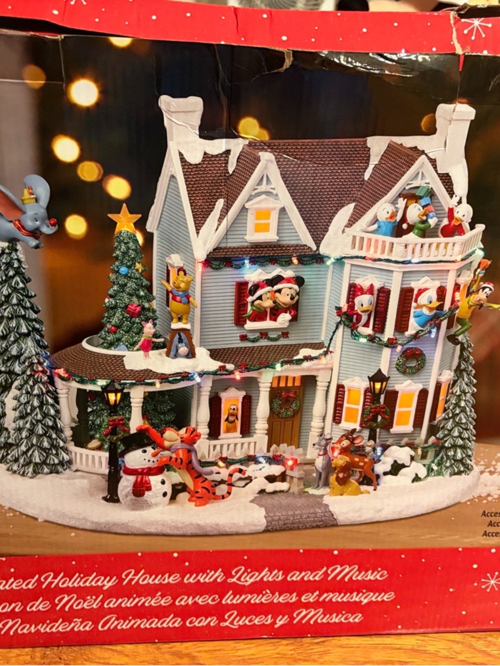 Disney Lighted Holiday Village House with snow accents.